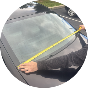 Measuring the widest point across the base of a car rear window for custom decals